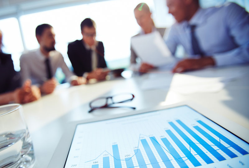 dental-1 financial analysis with a group of team members working at a table together